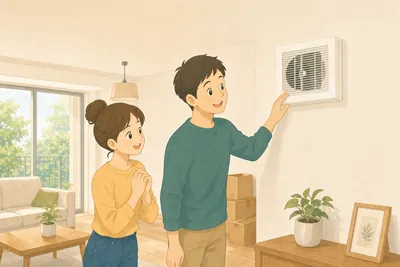 新居のリビングで換気口を確認する夫婦の様子